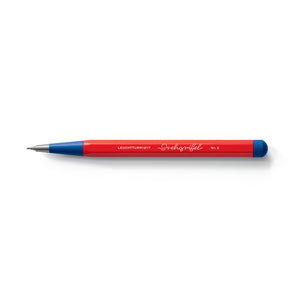 Red pencil with blue accents on a white background