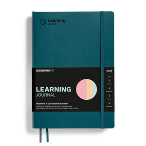 Teal learning journal with black label on a white background