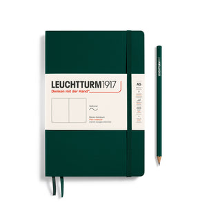 Green notebook with Leuchtturm1917 branding and a pencil on a white background