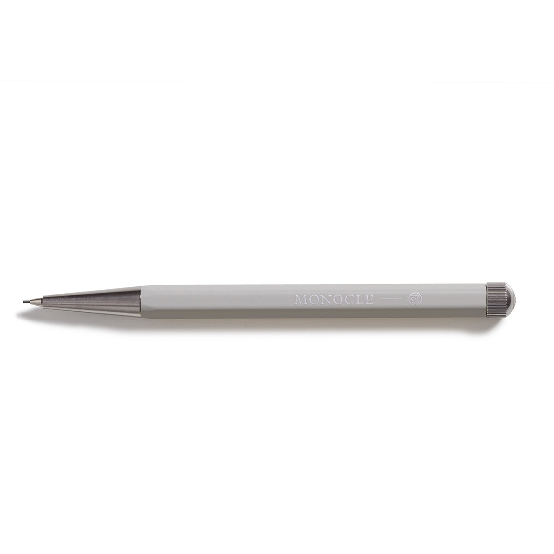 Pencil with 'Monocle' branding on a white background