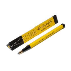 Yellow pen with black accents on a white background
