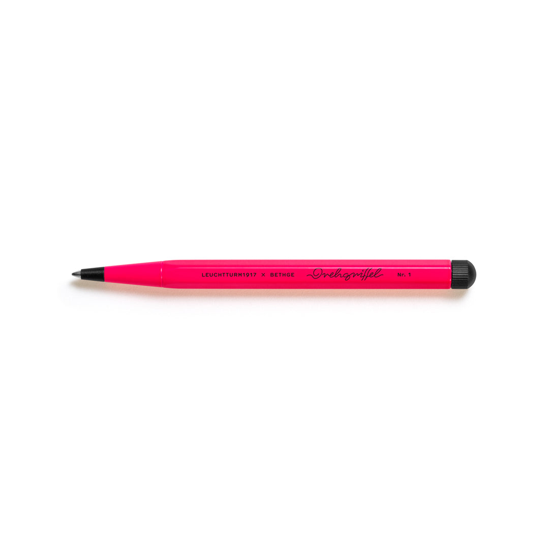 Pink pen with black cap on a white background