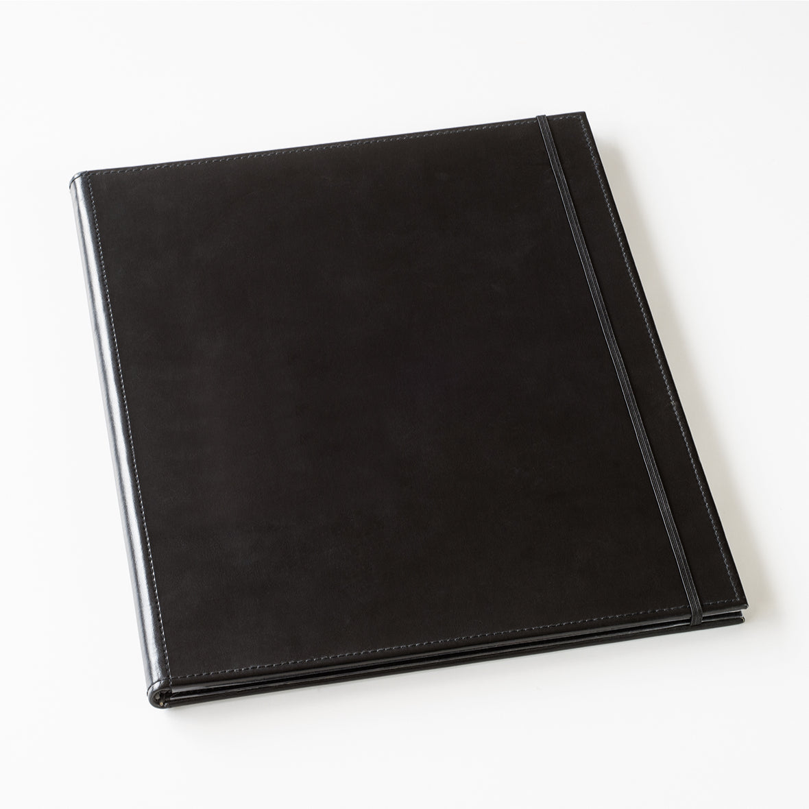 Black leather-bound album on a white background