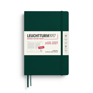Green notebook with white cover displaying Leuchtturm1917 branding and 2026-2027 planner details.