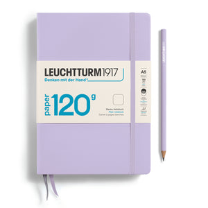 Purple notebook with Leuchtturm1917 branding and a pencil on a white background