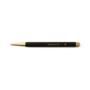 Black pen with gold accents on a white background