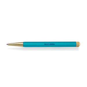 Teal pen with gold accents on a white background