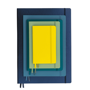 Stack of colorful notebooks with a yellow one on top