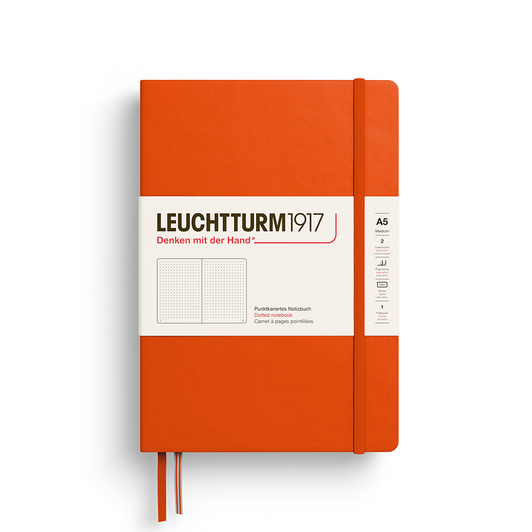 Orange notebook with white label featuring 'Leuchtturm1917' on a white background