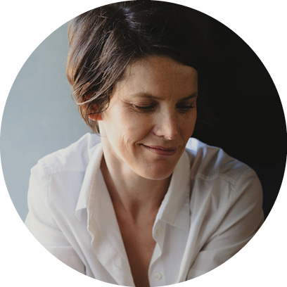 Woman wearing a white shirt against a light blue background