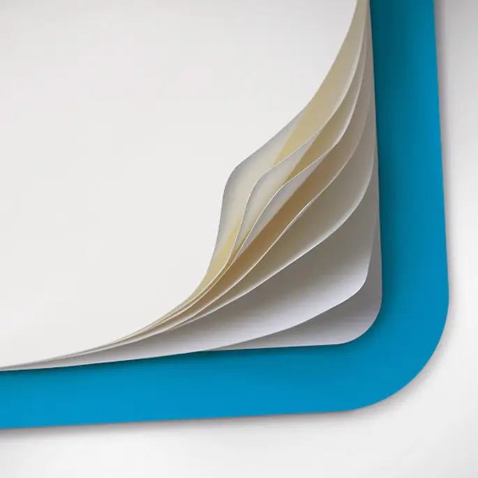 Stack of white paper sheets in a blue notebook on a white background