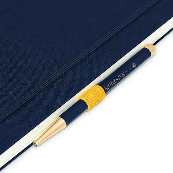 Pen with navy and gold design on a blue background