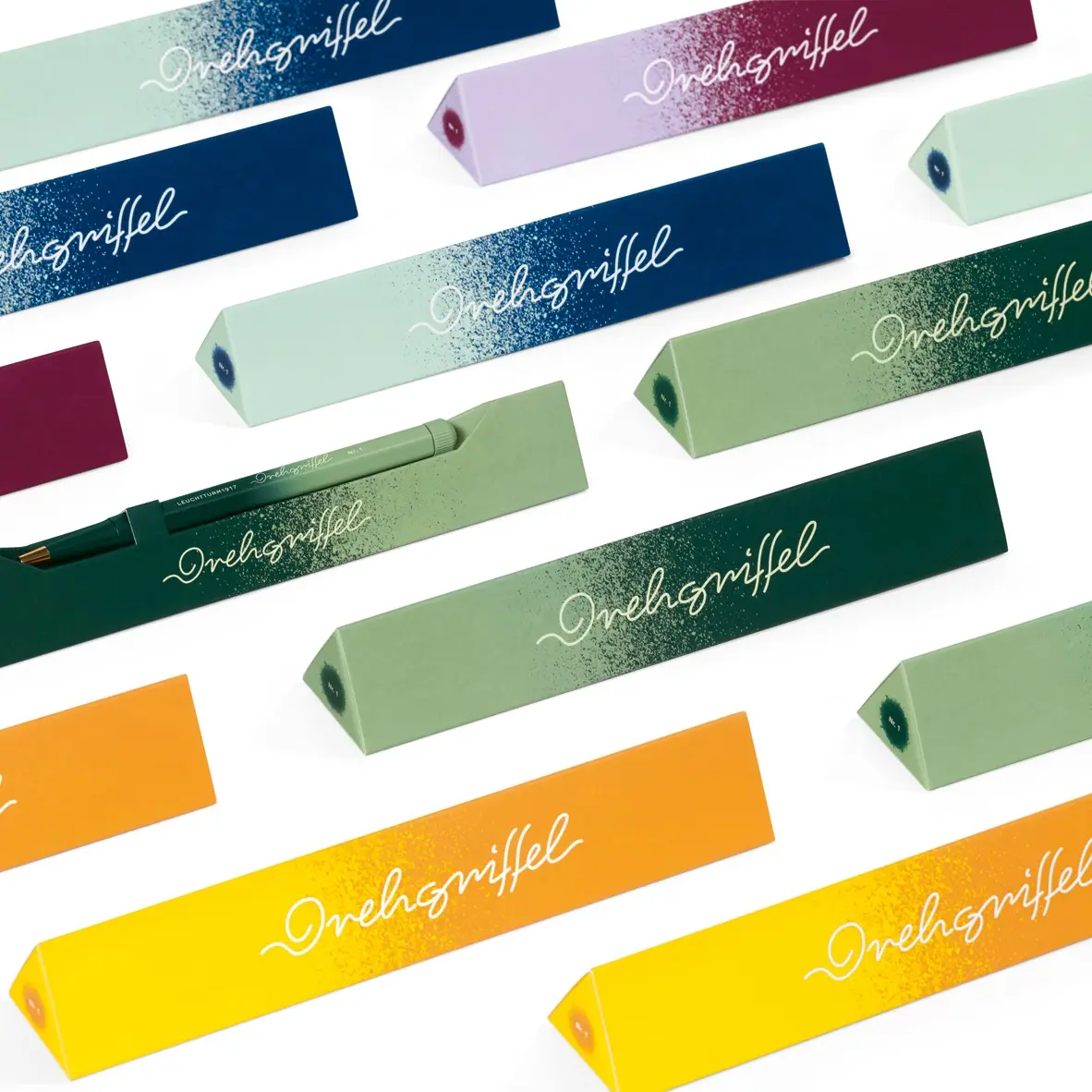 Colorful pen packaging with branding on a white background