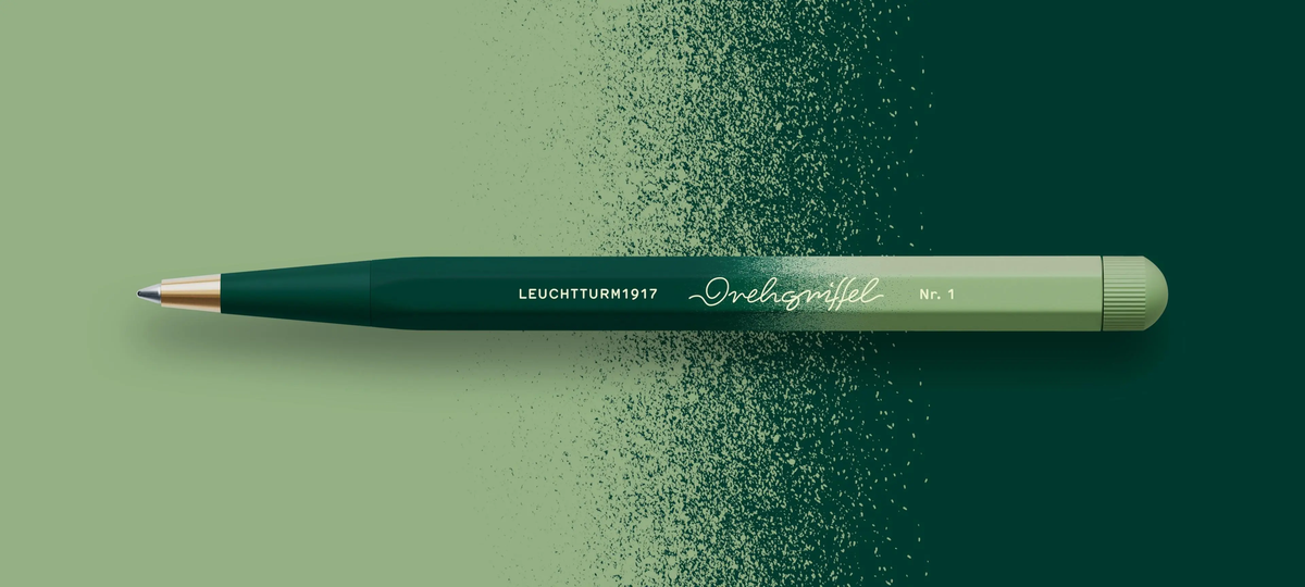 Green pen on a gradient green background