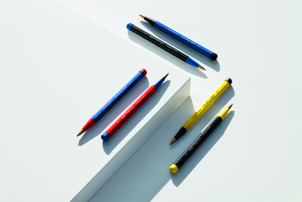 Colorful pens on a white surface