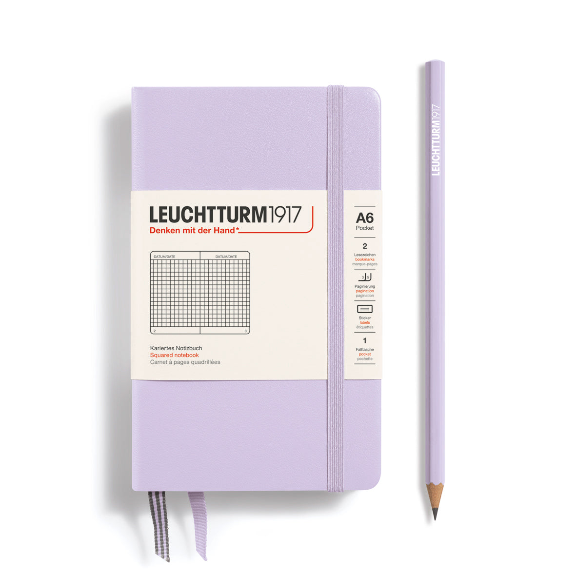 Purple notebook with a pencil on a white background, featuring Leuchtturm1917 branding.