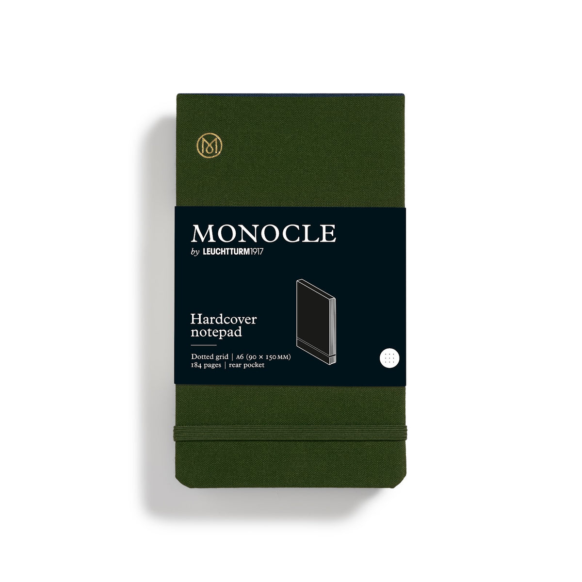Green Monocle notebook with black label on a white background