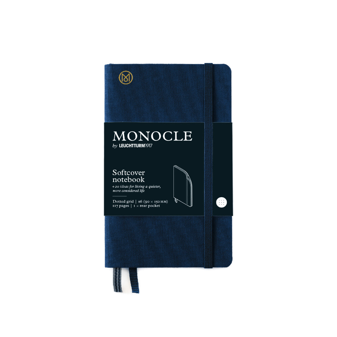 Navy blue notebook with 'Monocle' branding on a white background