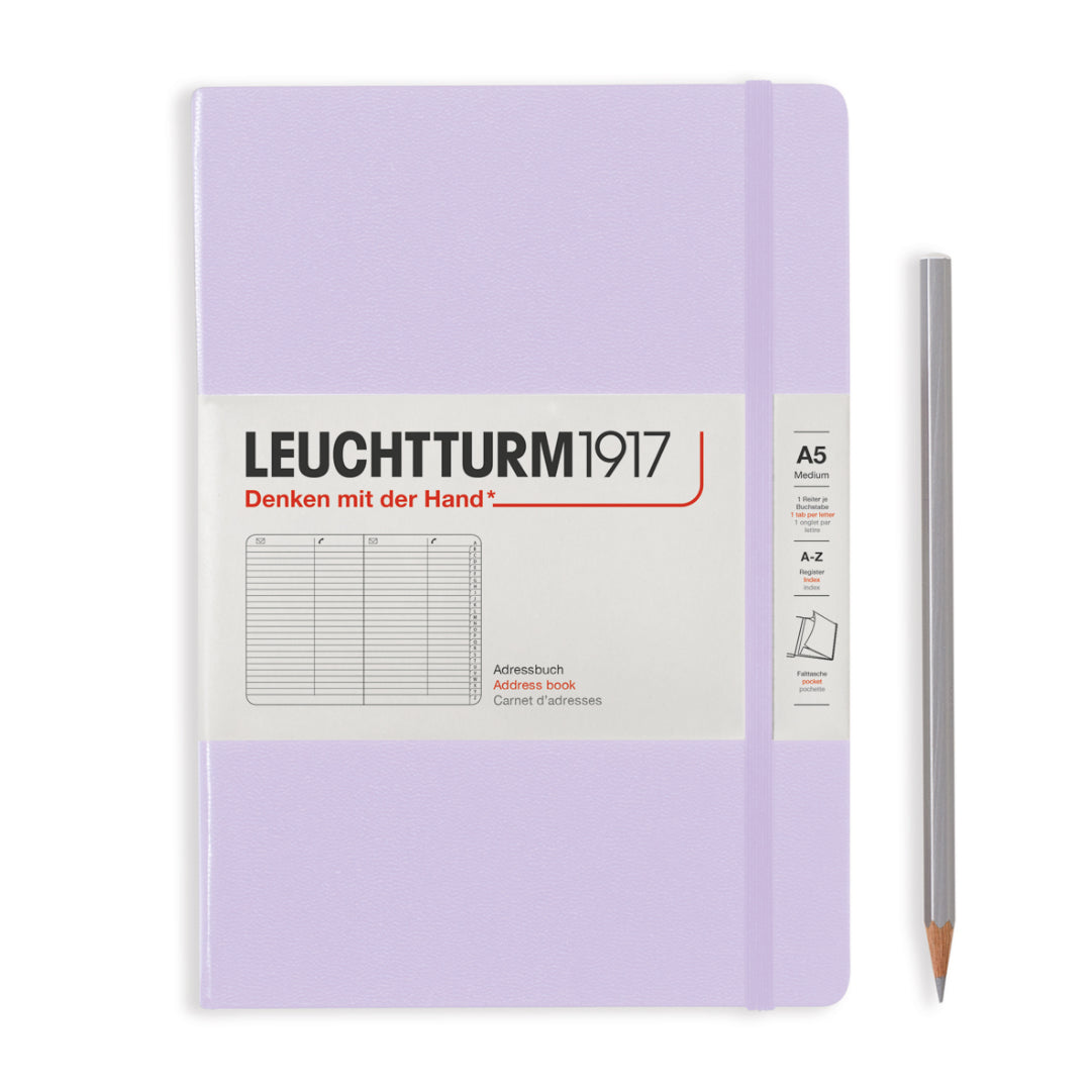 Purple notebook with Leuchtturm1917 branding and a pencil on a white background