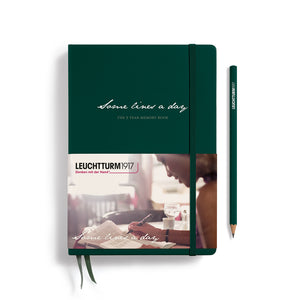 Green notebook with a pencil on a white background