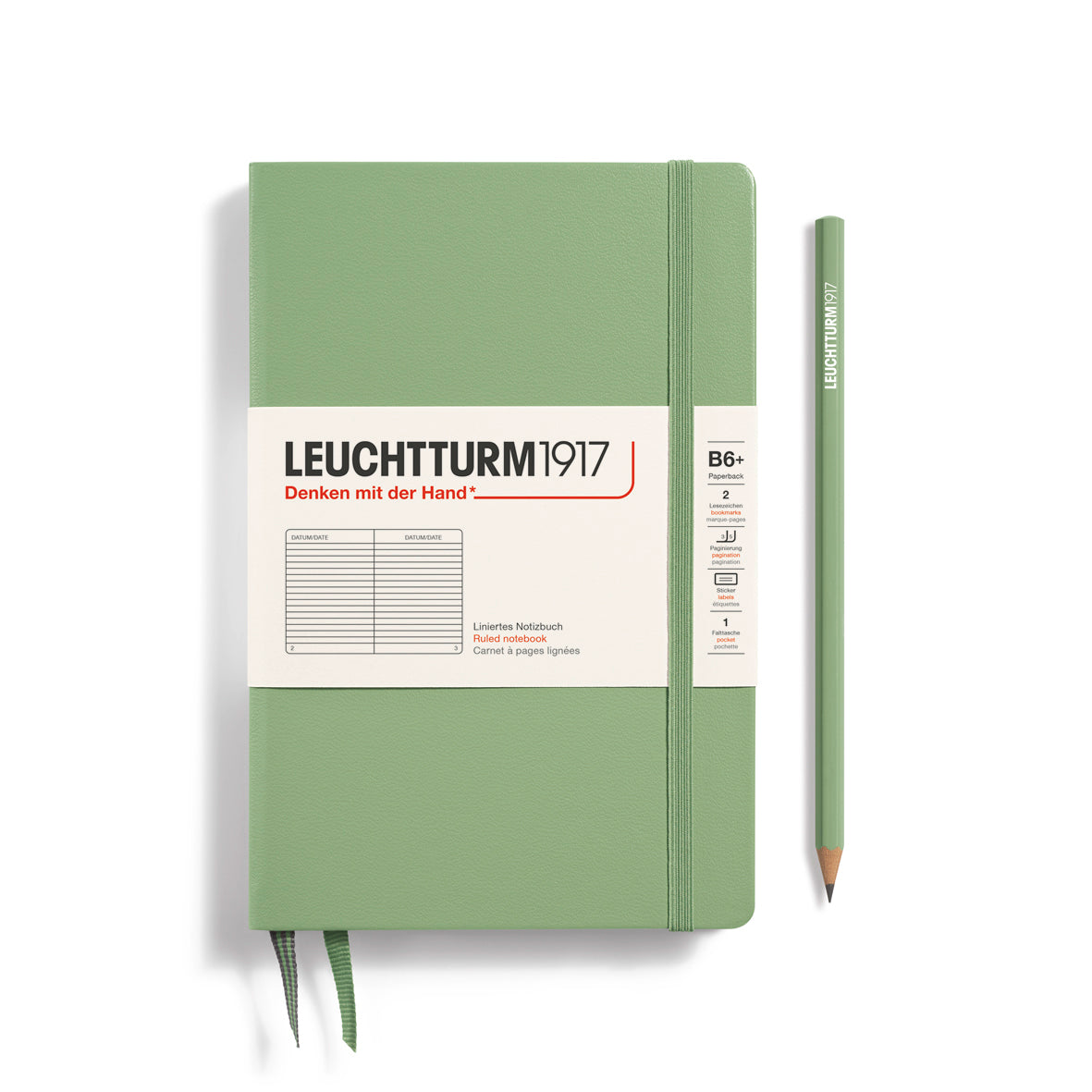 Green notebook with Leuchtturm1917 branding and a pencil on a white background