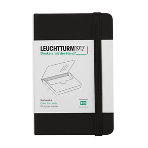 Black notebook with white label featuring Leuchtturm1917 branding on a white background