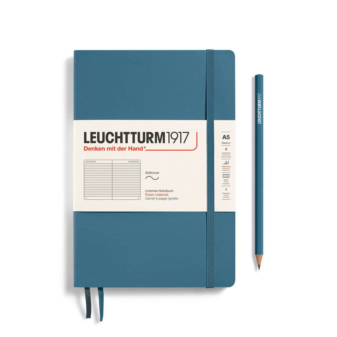 Blue notebook with white label and pencil on a white background, featuring Leuchtturm1917 branding.