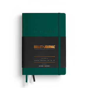Green Bullet Journal notebook on a white background