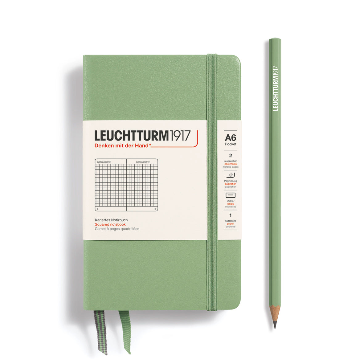 Green notebook with a pencil on a white background, featuring Leuchtturm1917 branding.
