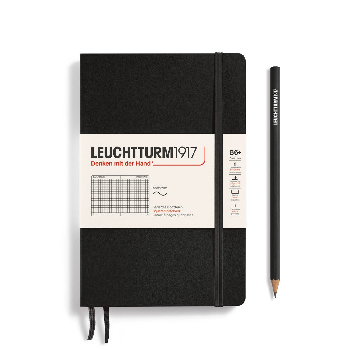 Black notebook with white label and pencil on a white background