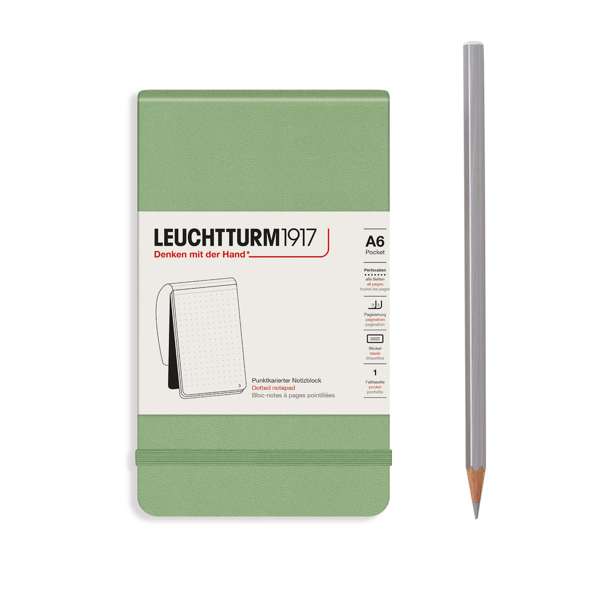 Green notebook with white label and pencil on a white background