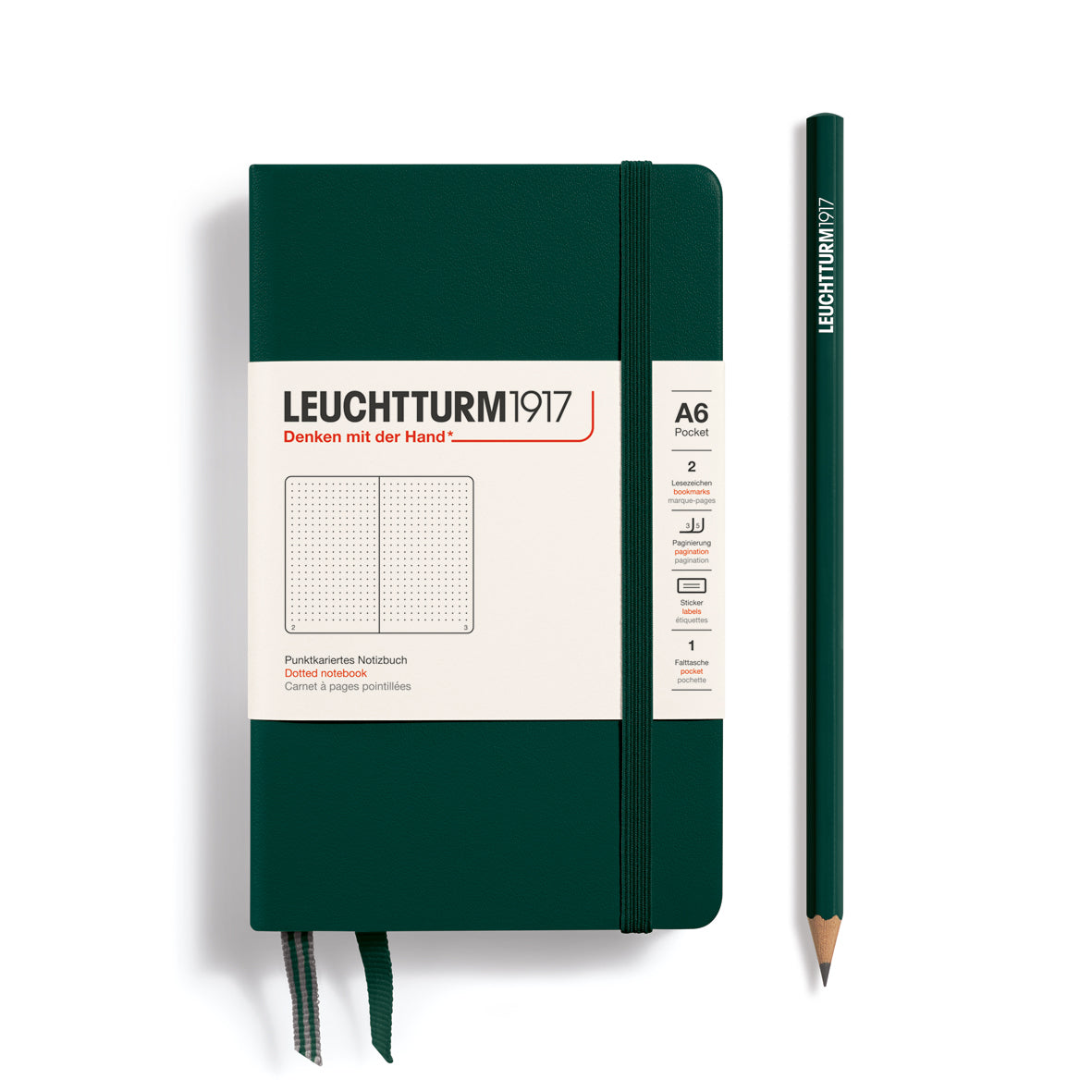 Green notebook with white label and matching pencil on a white background