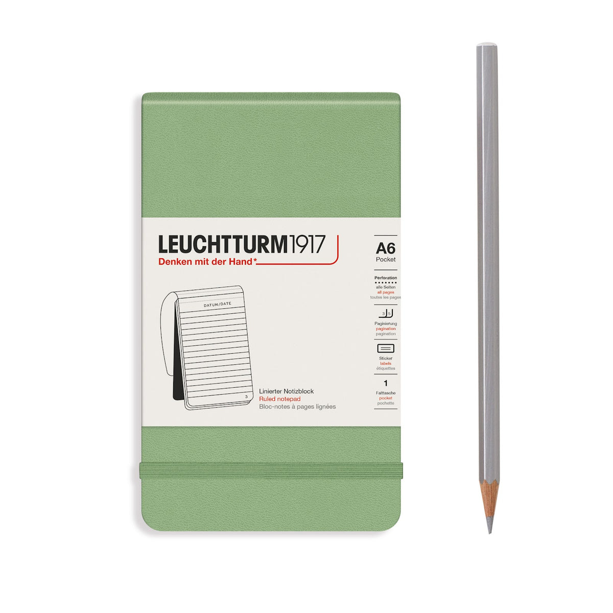 Green notebook with Leuchtturm1917 branding and a pencil on a white background