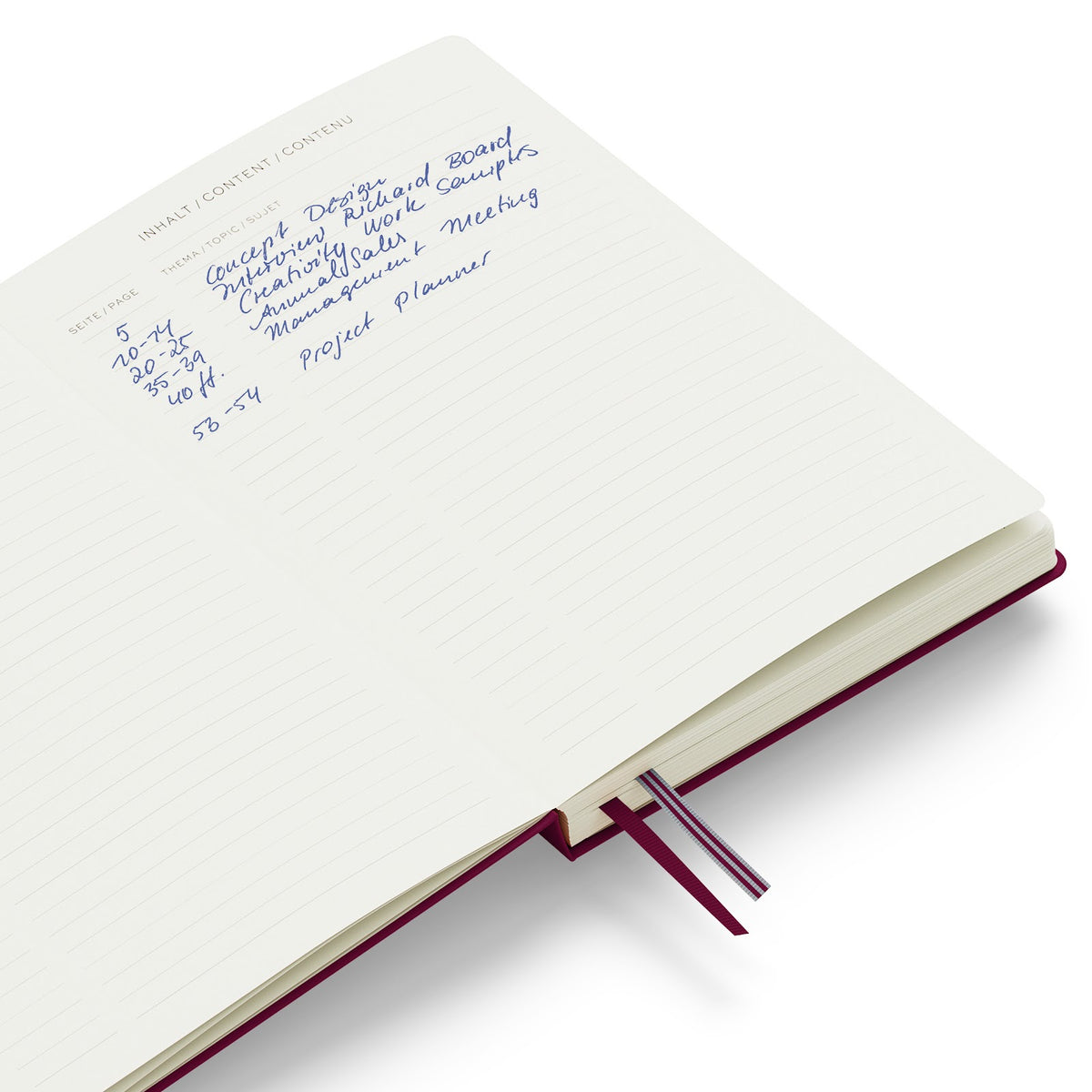 Open notebook with handwritten text on a white background