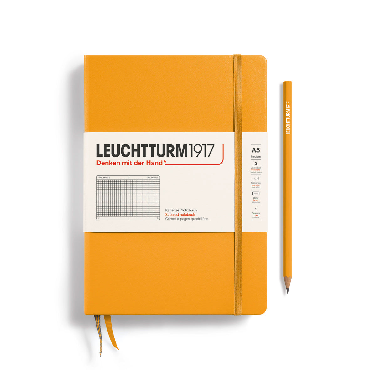 Orange notebook with a pen on a white background, featuring Leuchtturm1917 branding.