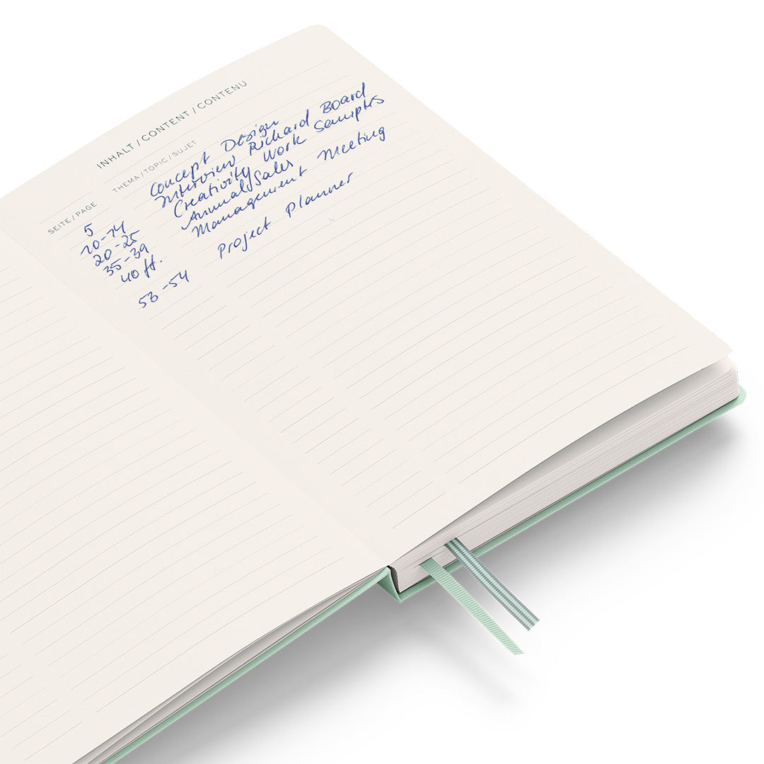 Notebook with handwritten text on a white background