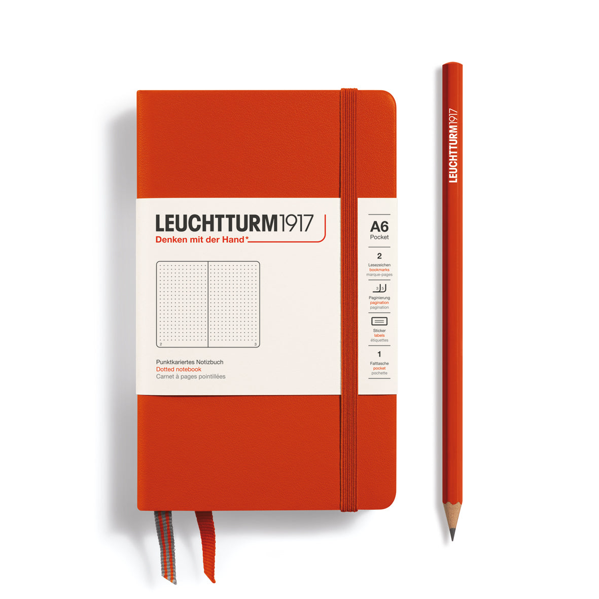 Orange notebook with a pencil on a white background, featuring Leuchtturm1917 branding.
