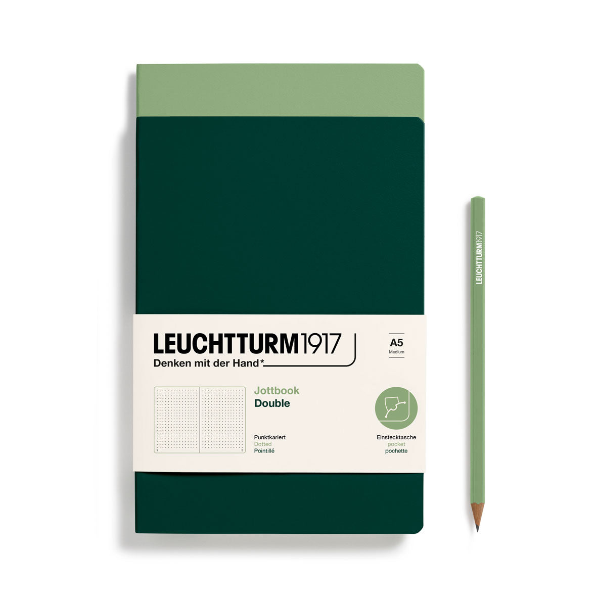 Leuchtturm1917 notebook with a green pencil on a white background