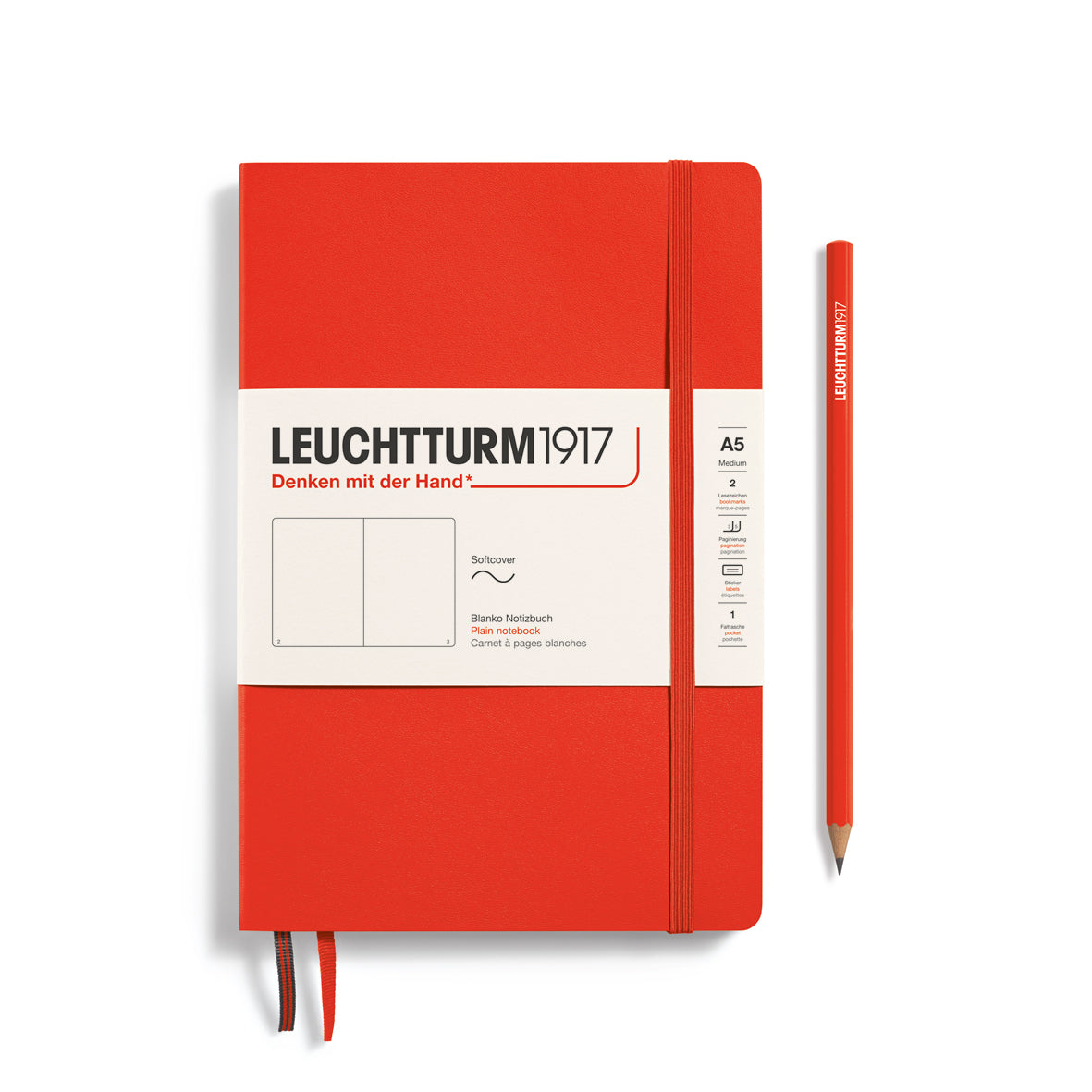 Red notebook with white label and pencil on a white background, featuring Leuchtturm1917 branding.