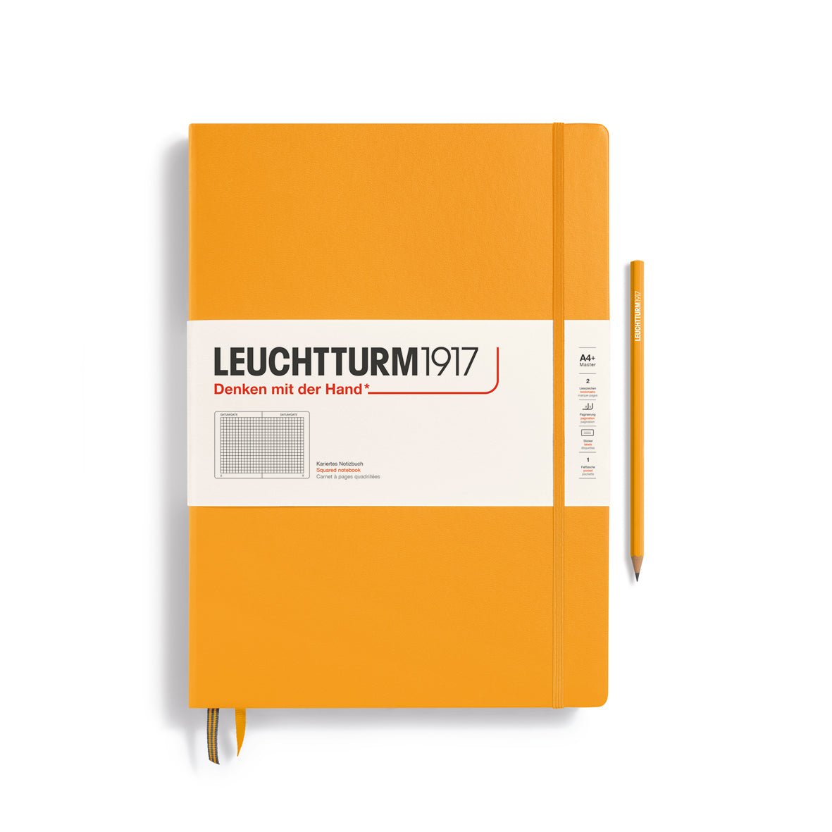Orange notebook with a pen on a white background, featuring the Leuchtturm1917 brand.