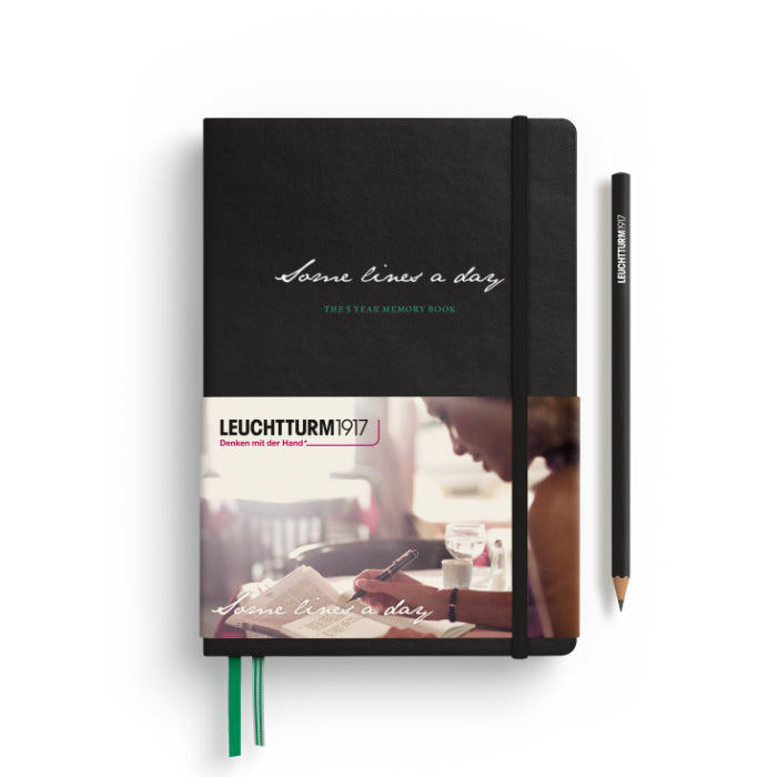 Black notebook with label featuring Leuchtturm1917 branding, and a pencil on a white background.