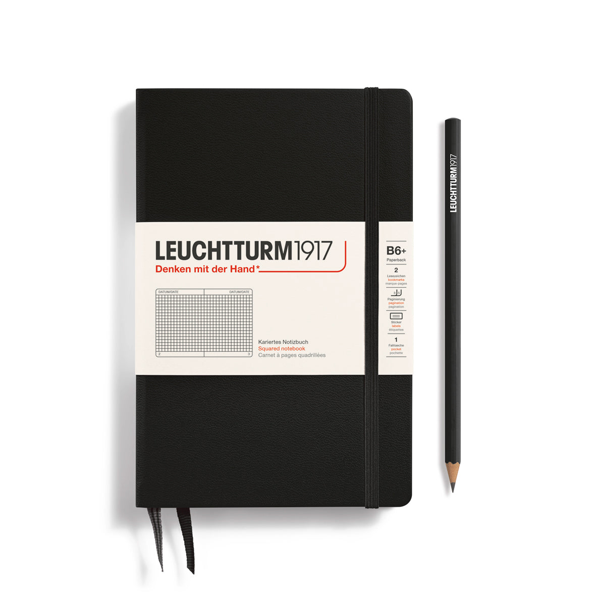 Black notebook with Leuchtturm1917 branding and a pencil on a white background