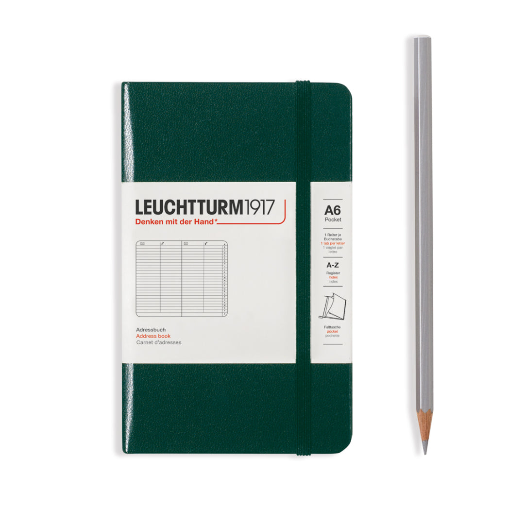 Green notebook with Leuchtturm1917 branding and a pencil on a white background