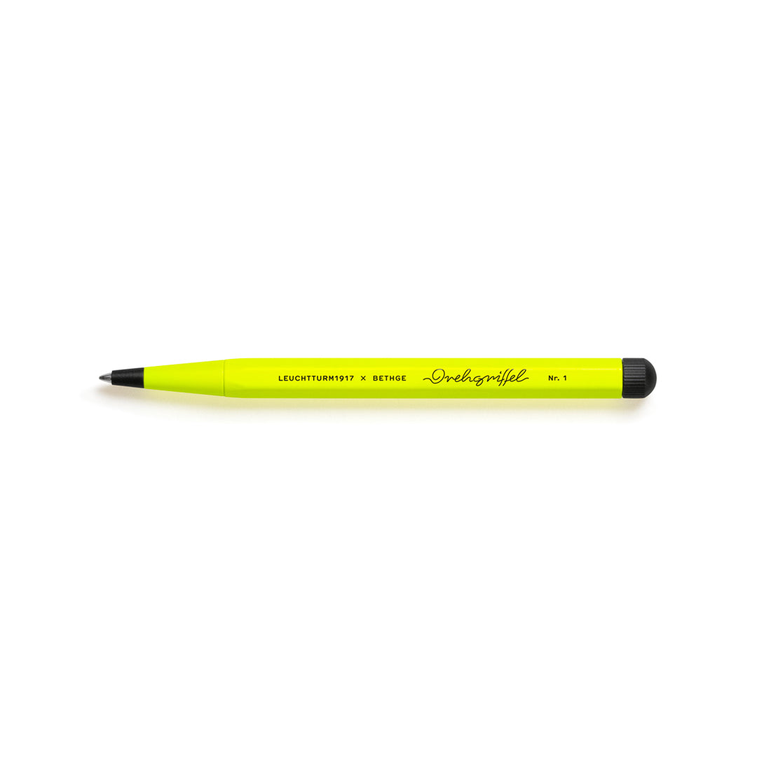 Yellow pen with black accents on a white background