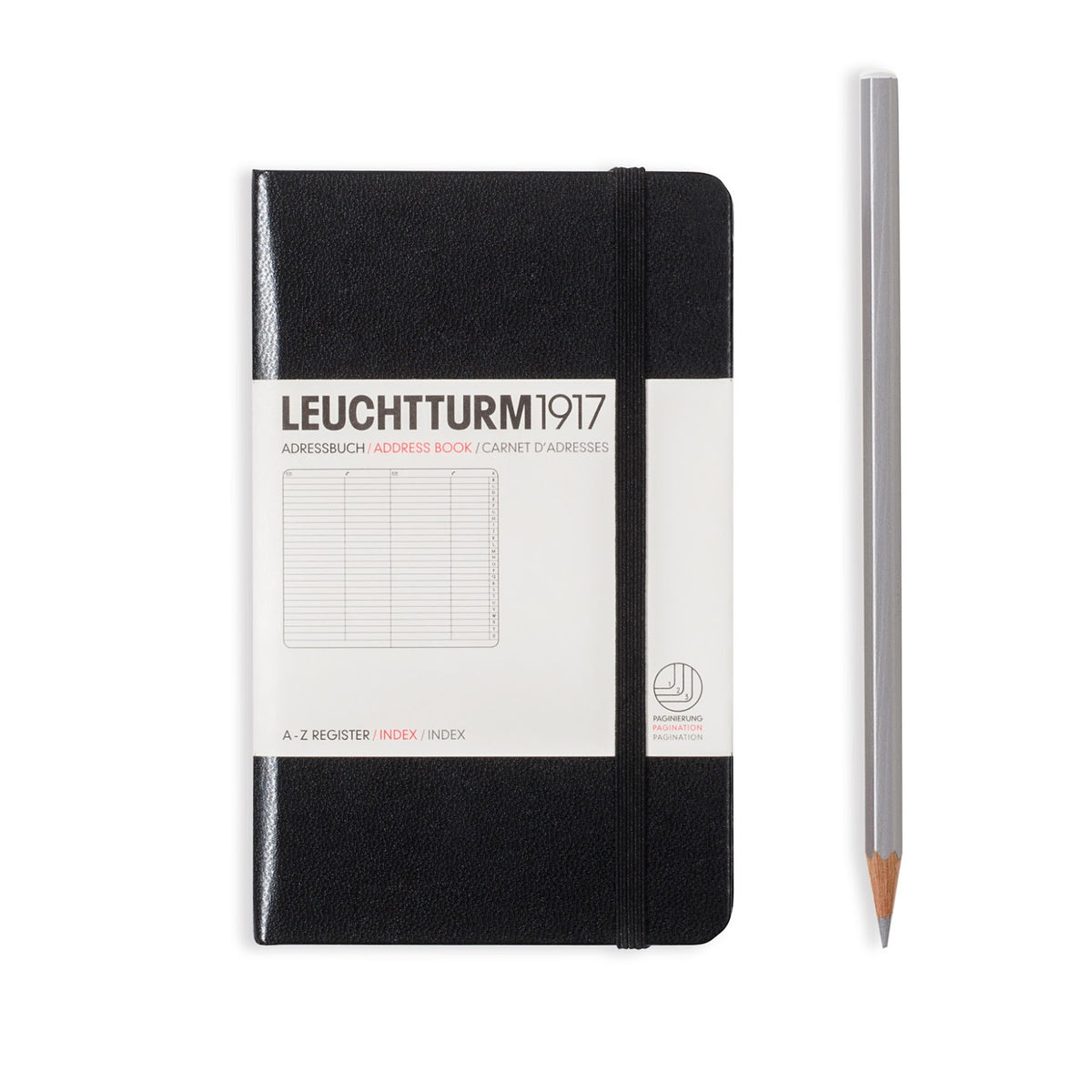 Black notebook with white label and a silver pencil on a white background