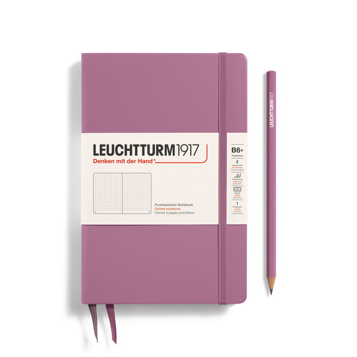 Purple notebook with white label and pencil on a white background