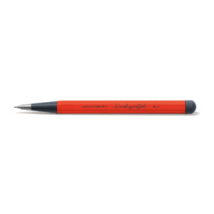 Red pencil with black cap on a white background