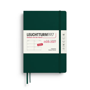 Green Leuchtturm1917 planner with white cover displaying text and design elements.