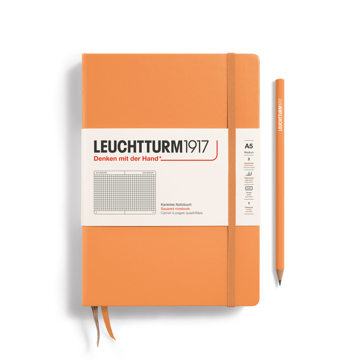 Orange notebook with a pen on a white background, featuring Leuchtturm1917 branding.