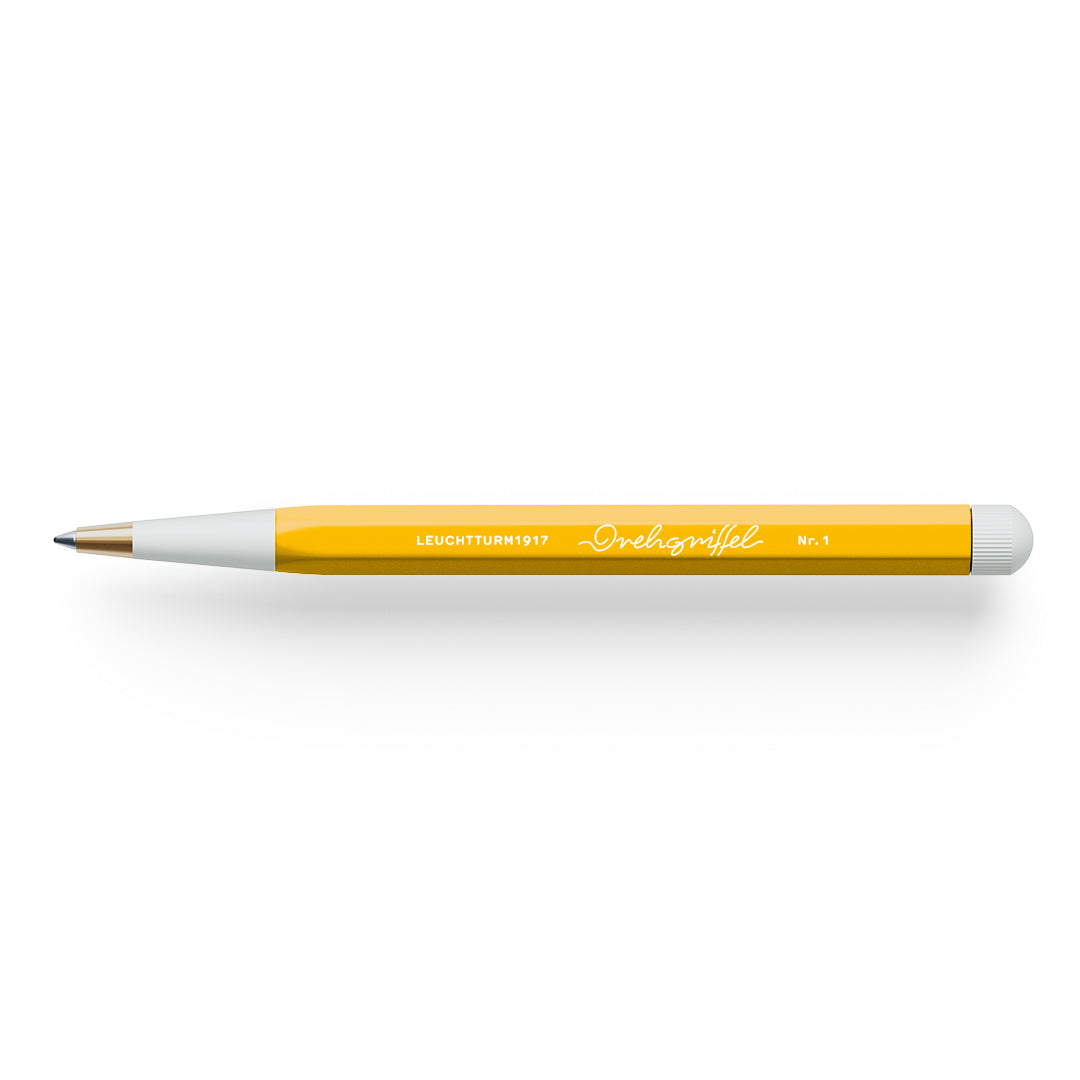 Pen with a yellow barrel and white grip on a white background